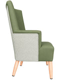 An upholstered accent chair with an olive green velvet seat and back, featuring a light gray and white chevron patterned fabric panel on the sides, supported by light wood legs.