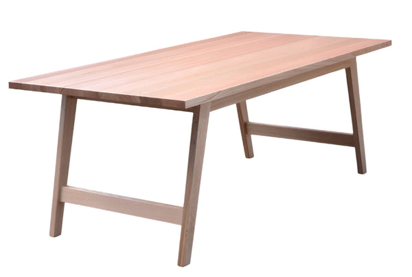A rectangular Clarence Timber Table with a smooth finish and sturdy legs, designed for commercial use.